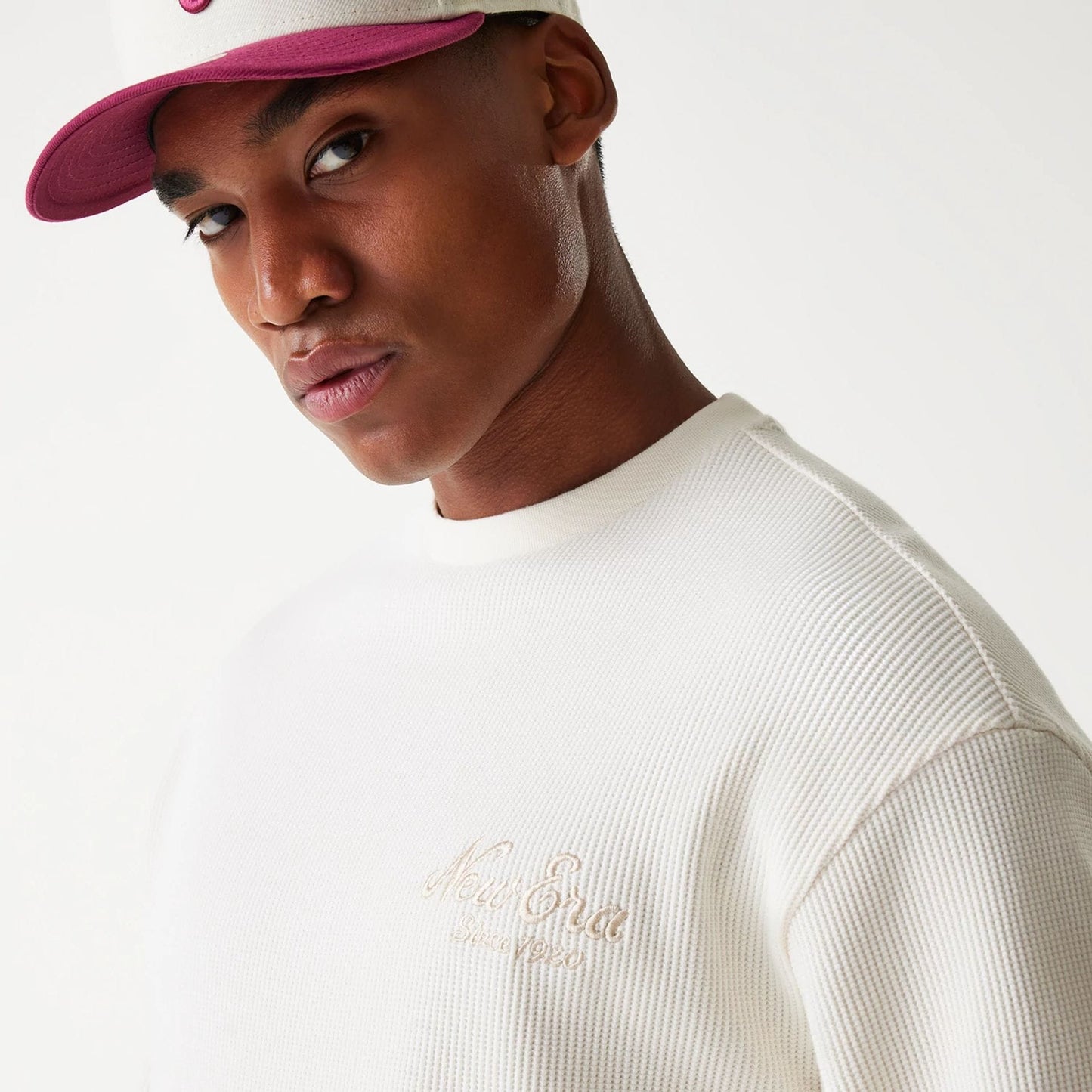 The Male model is wearing New Era Waffle Open White Oversized Crew Neck Sweater 6