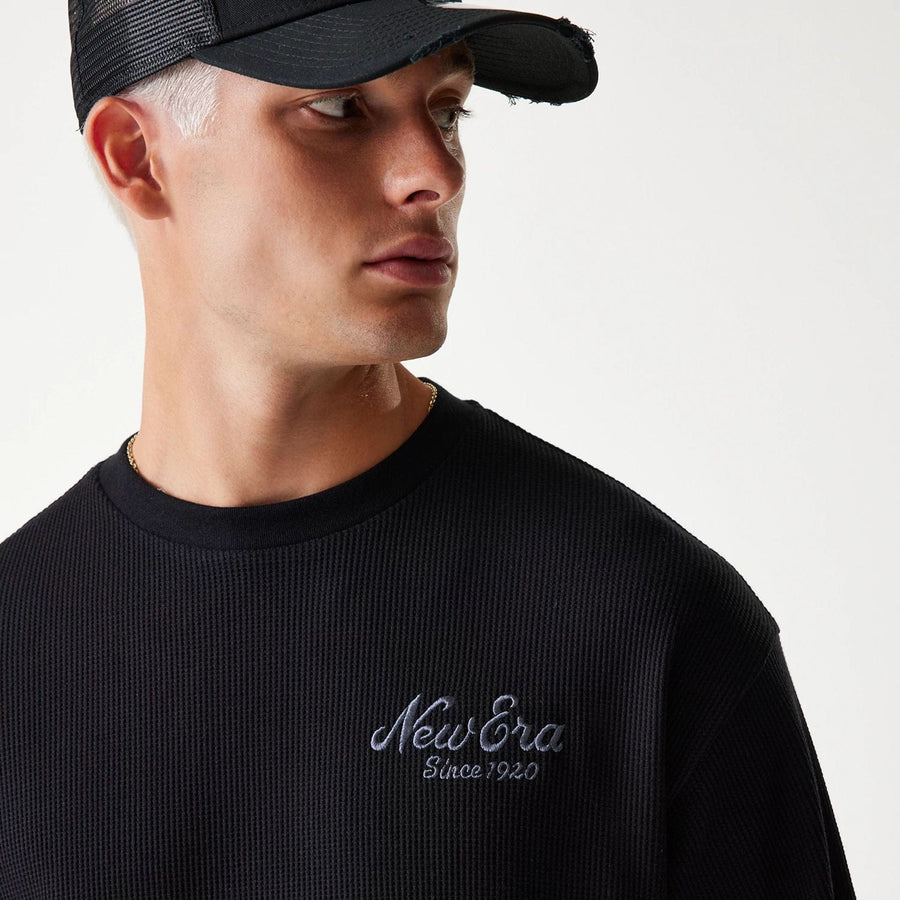 The Male model is wearing New Era Waffle Black Oversized T-Shirt 5