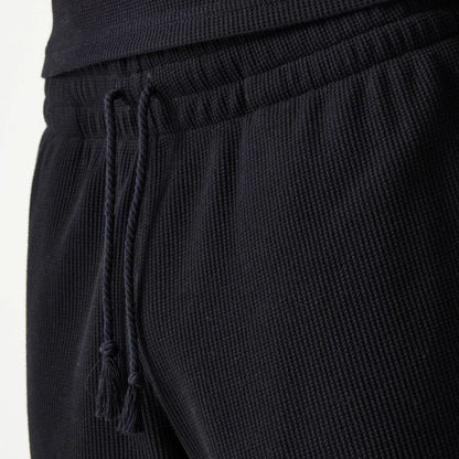 The Male model is wearing New Era Waffle Black Shorts 8