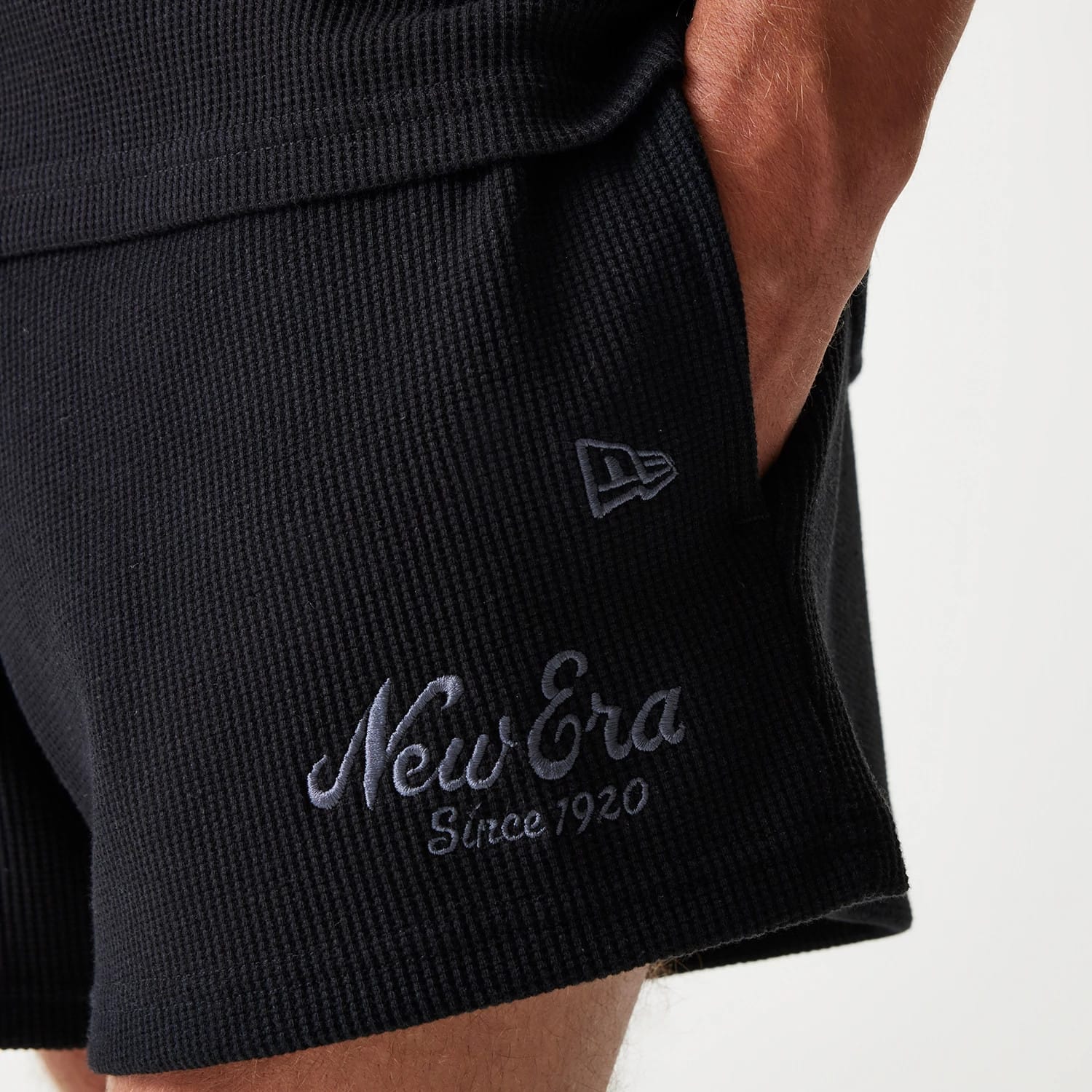 The Male model is wearing New Era Waffle Black Shorts 6
