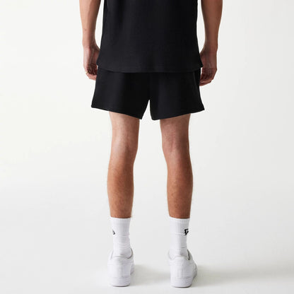 The Male model is wearing New Era Waffle Black Shorts 2