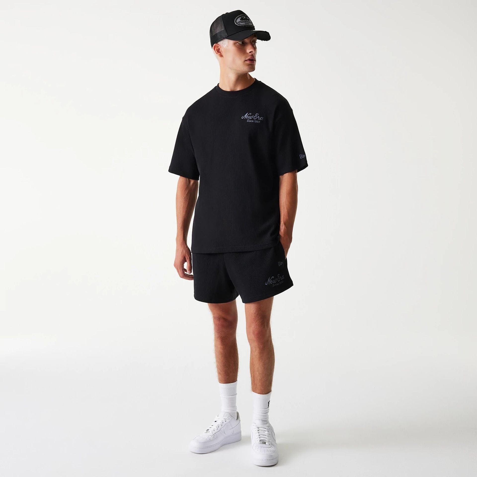 The Male model is wearing New Era Waffle Black Shorts 7