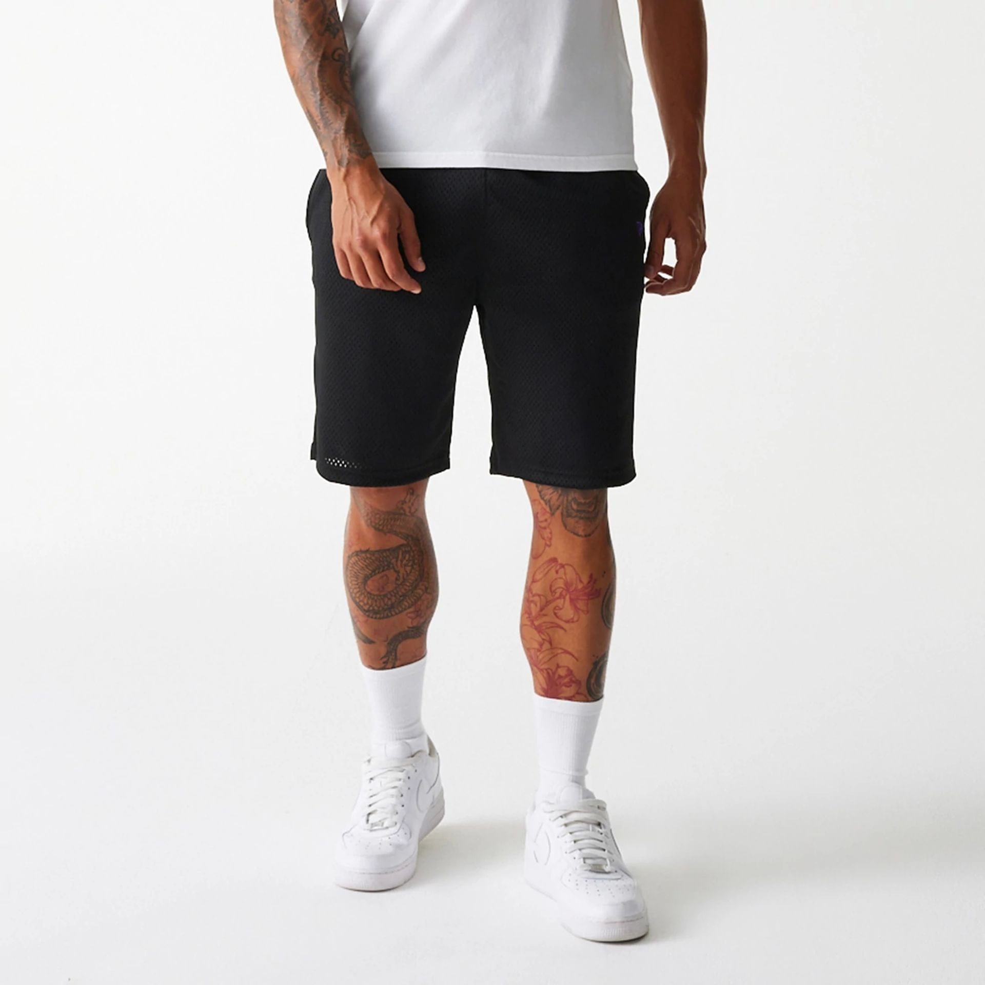 The Male model is wearing New Era Black Mesh Shorts 3