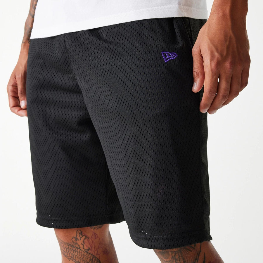 The Male model is wearing New Era Black Mesh Shorts 4