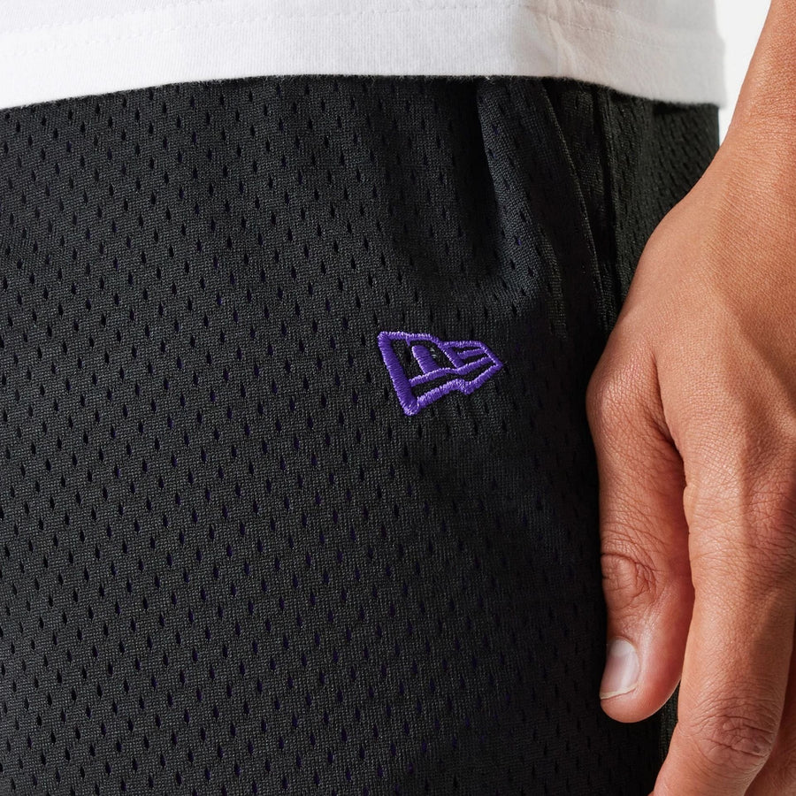 The Male model is wearing New Era Black Mesh Shorts 6