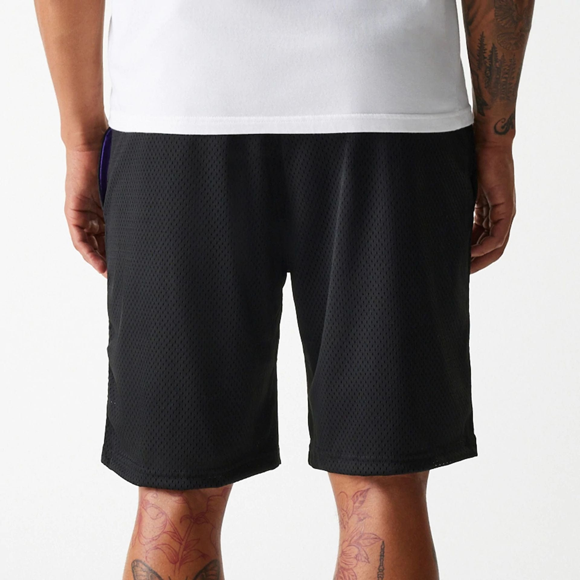 The Male model is wearing New Era Black Mesh Shorts 5