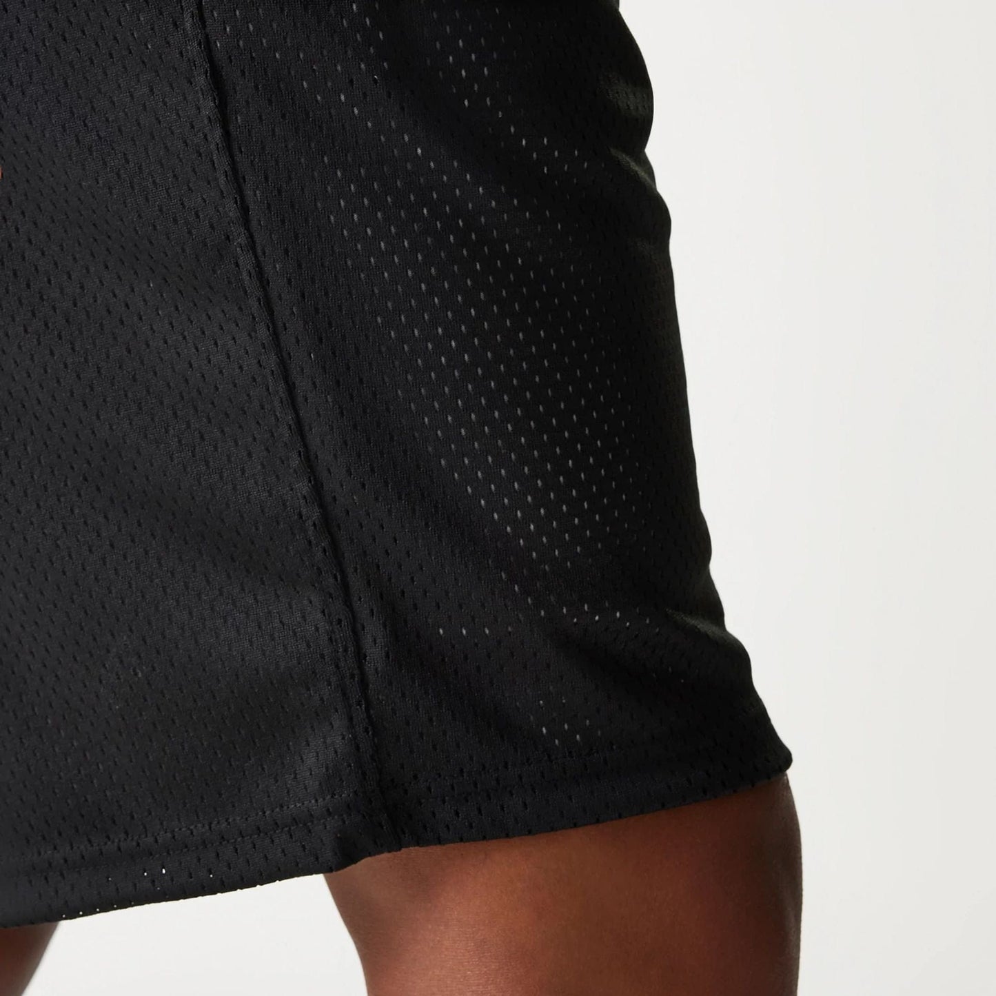 The Male model is wearing New Era Black Mesh Shorts 7