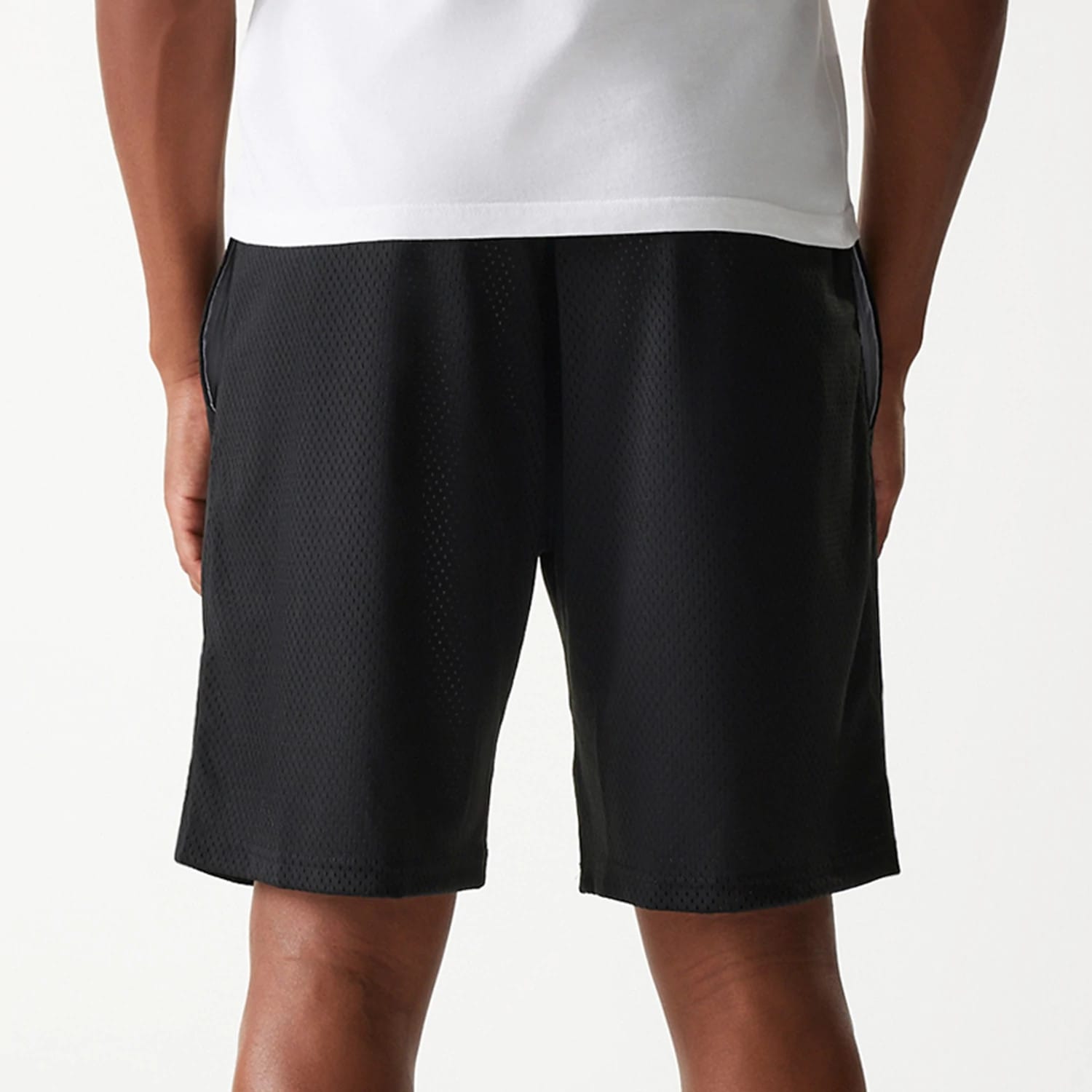 The Male model is wearing New Era Black Mesh Shorts 5