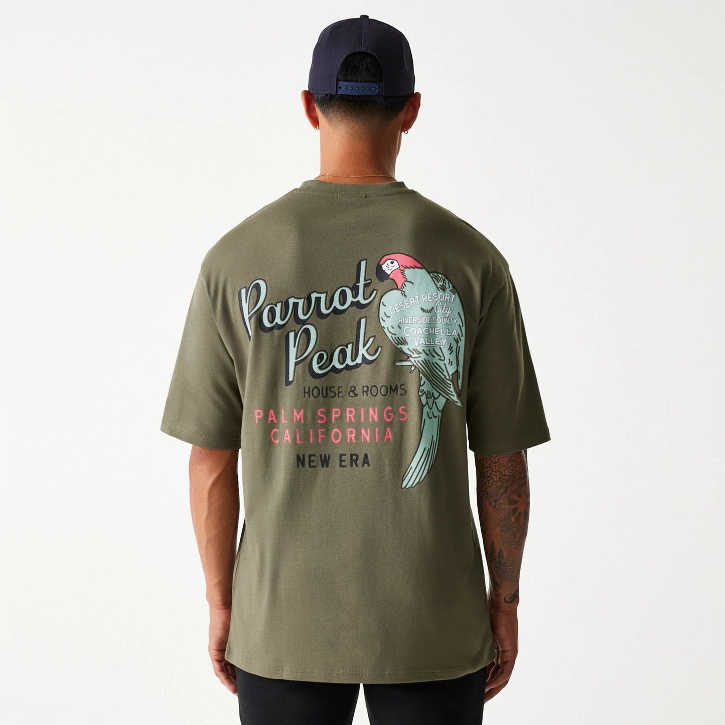 The Male model is wearing New Era Animal Graphic Green Oversized T-Shirt 2