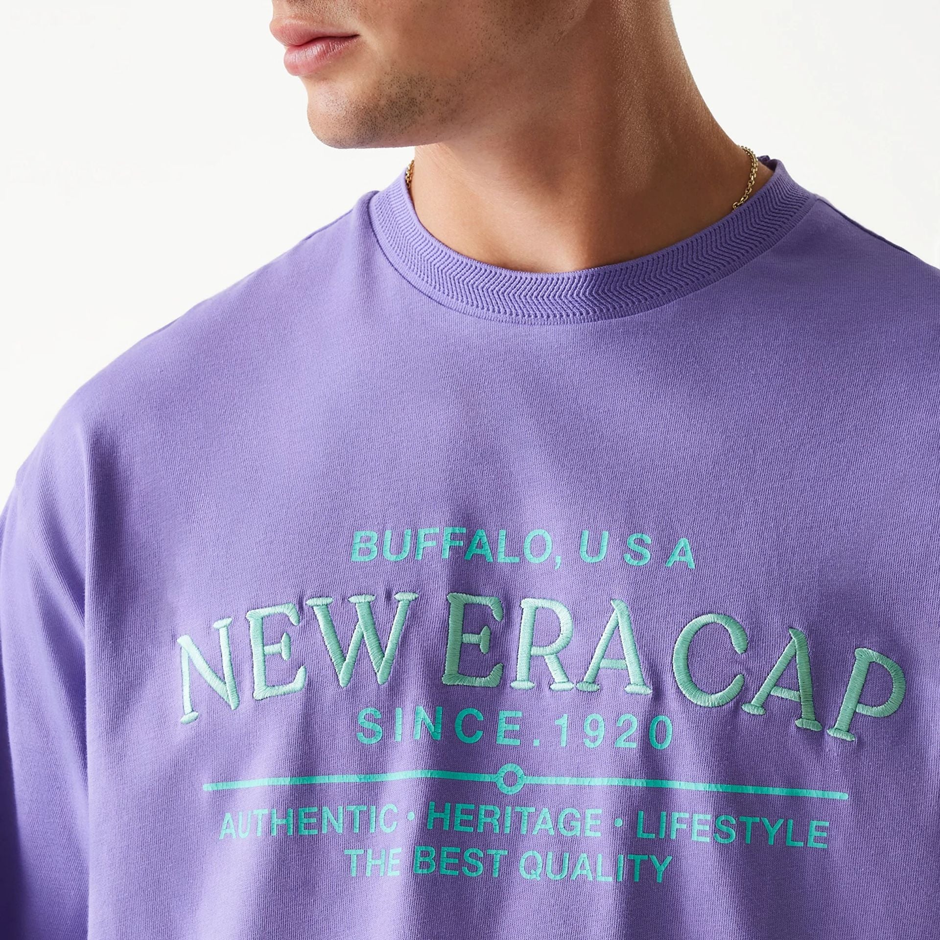 The Male model is wearing New Era Graphic Purple Oversized T-Shirt 6