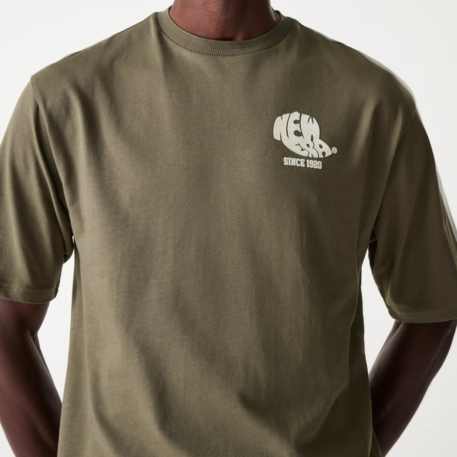 The Male model is wearing New Era Graphic Green Oversized T-Shirt 3