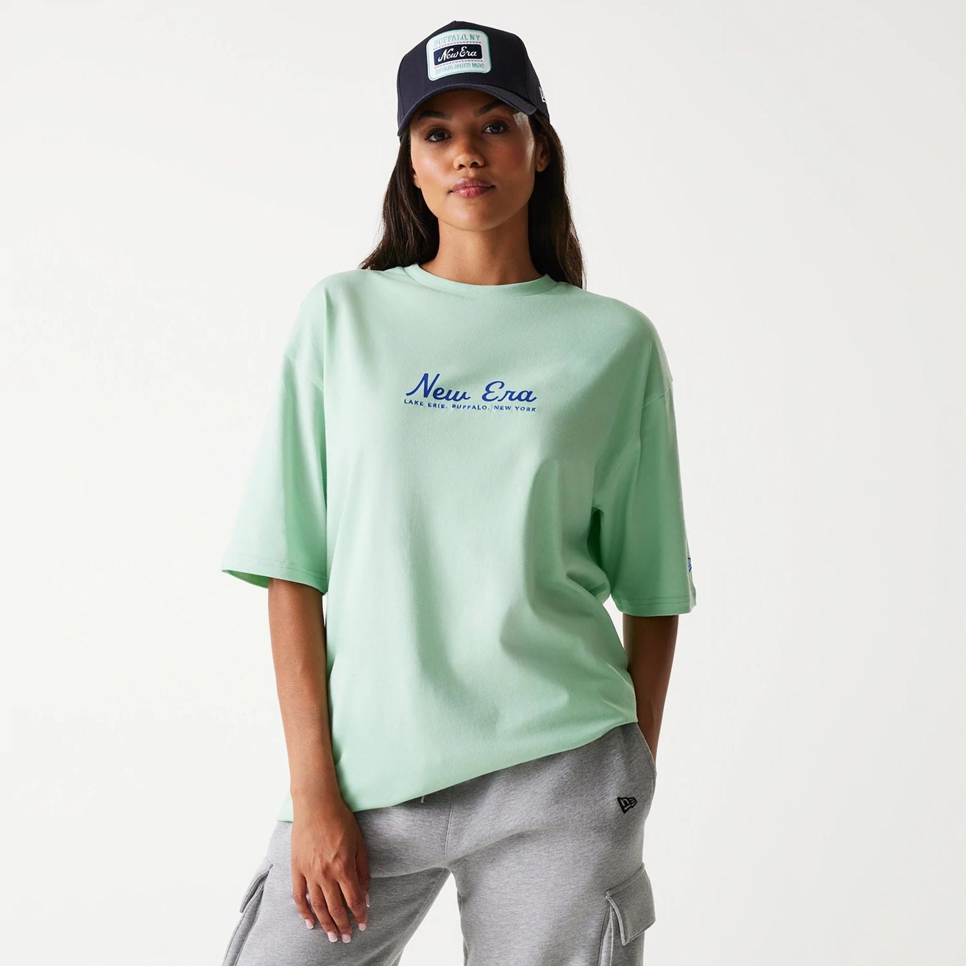 The Male model is wearing New Era Vacation Graphic Pastel Green Oversized T-Shirt 4