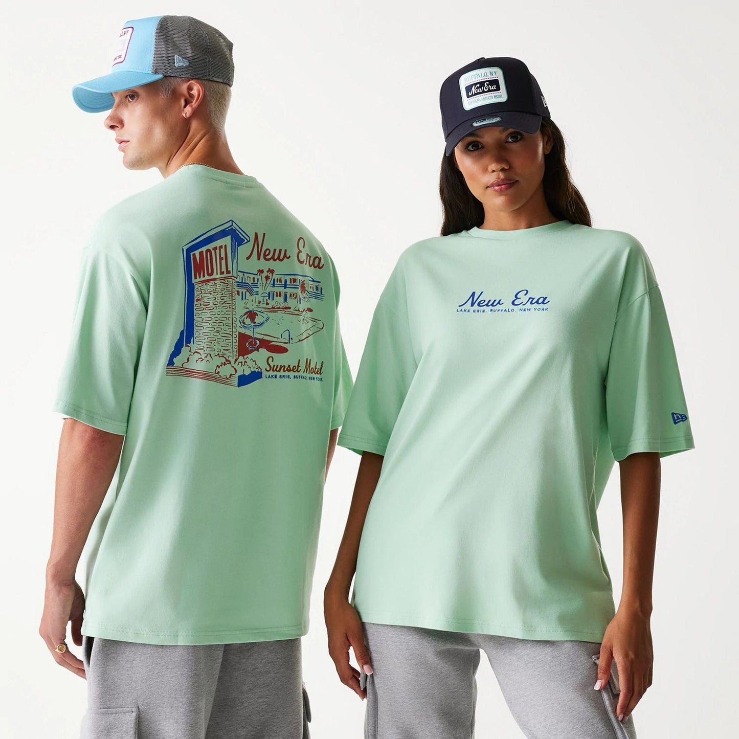 The Male model is wearing New Era Vacation Graphic Pastel Green Oversized T-Shirt 1