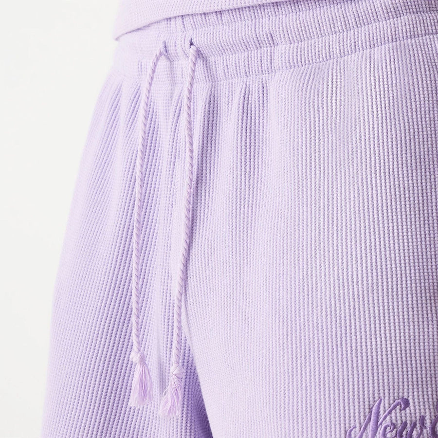 The Male model is wearing New Era Waffle Pastel Purple Shorts 7