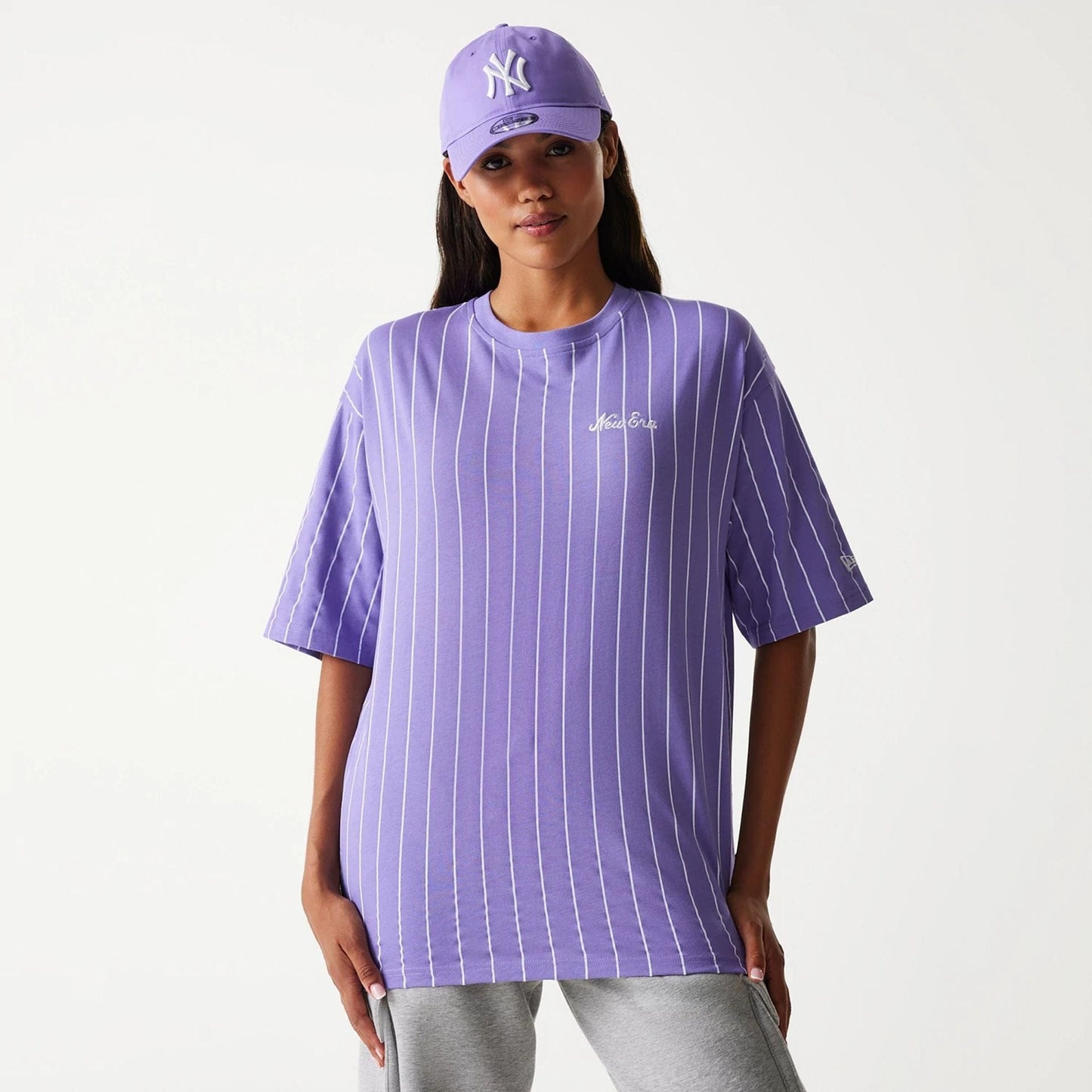 The Male model is wearing New Era Pinstripe Purple Oversized T-Shirt 3
