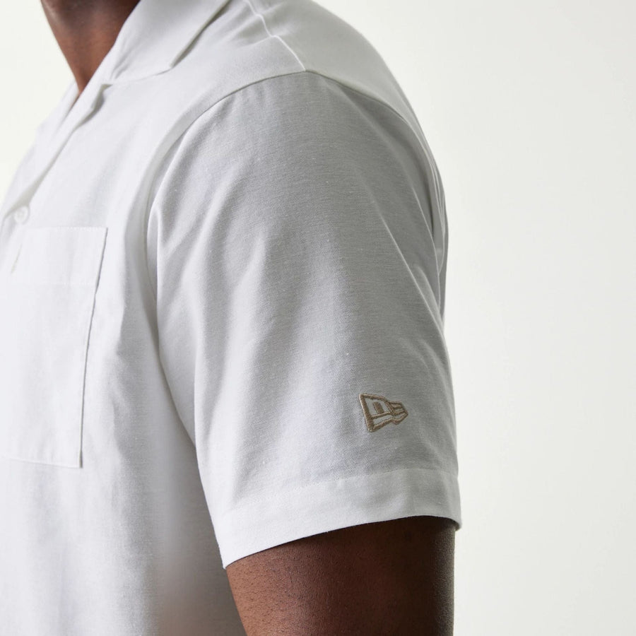 The Male model is wearing New Era White Revere Short Sleeve Shirt 5