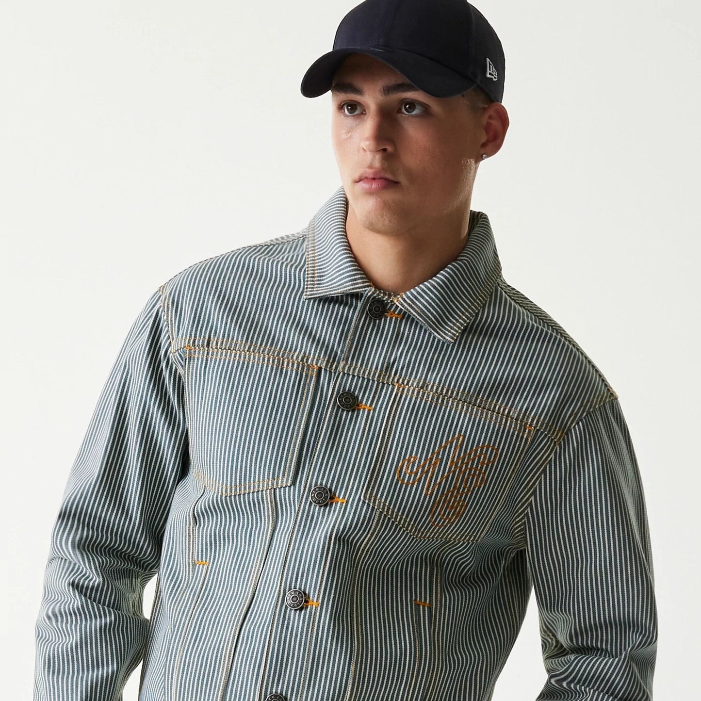 The Male model is wearing New Era Blue Denim Jacket 7