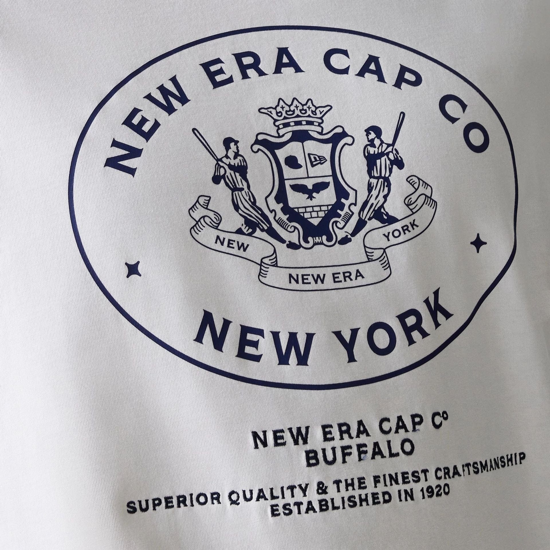 The Male model is wearing New Era Crest White Oversized T-Shirt 5