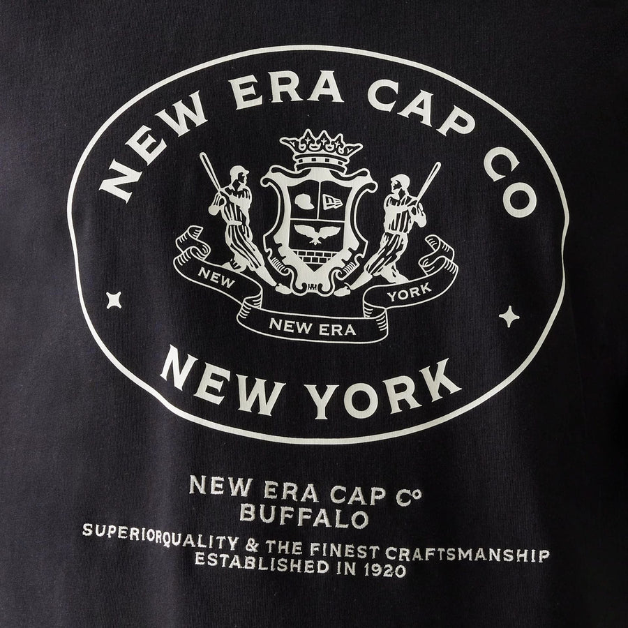 The Male model is wearing New Era Crest Black Oversized T-Shirt 4