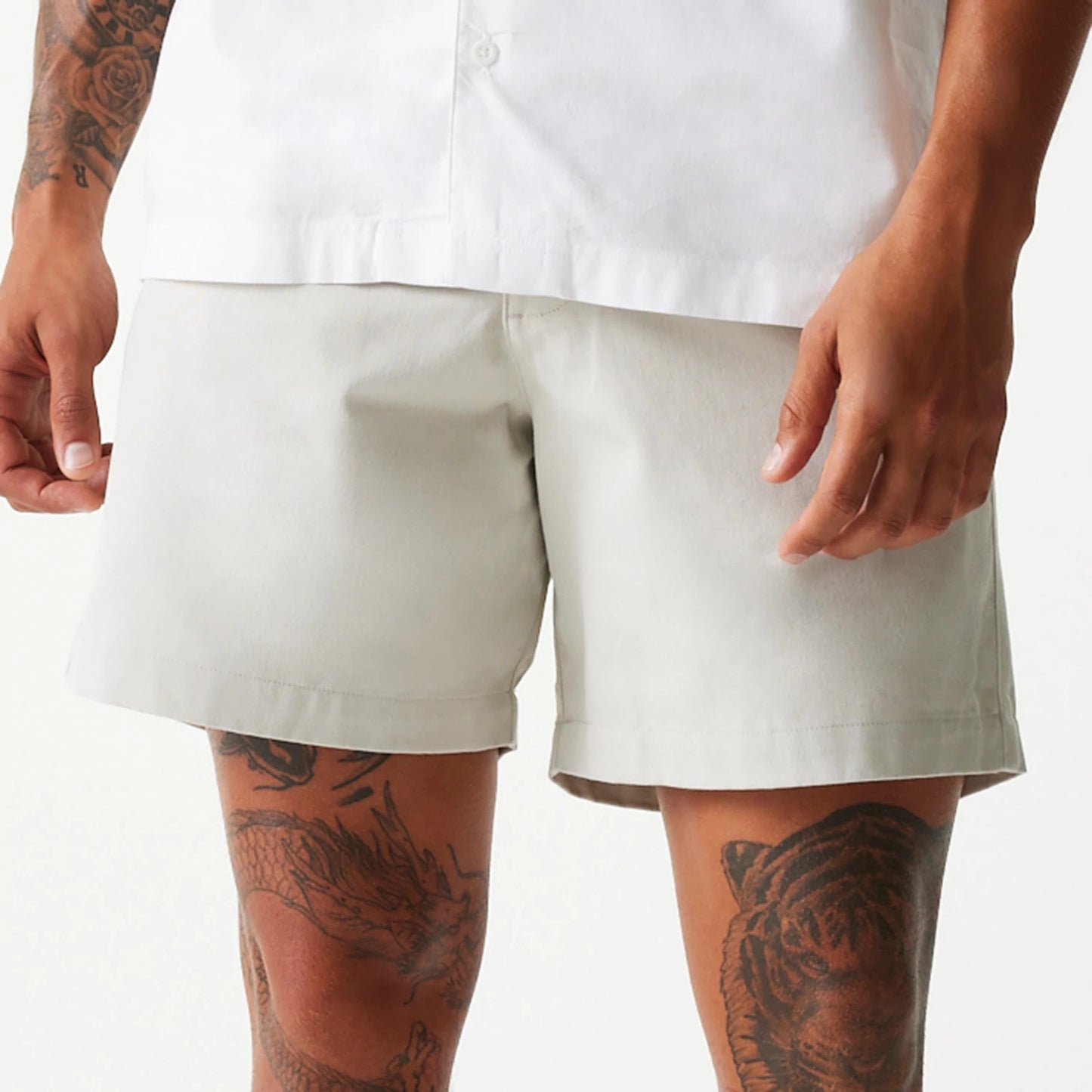 The Male model is wearing New Era Cream Chino Shorts 6