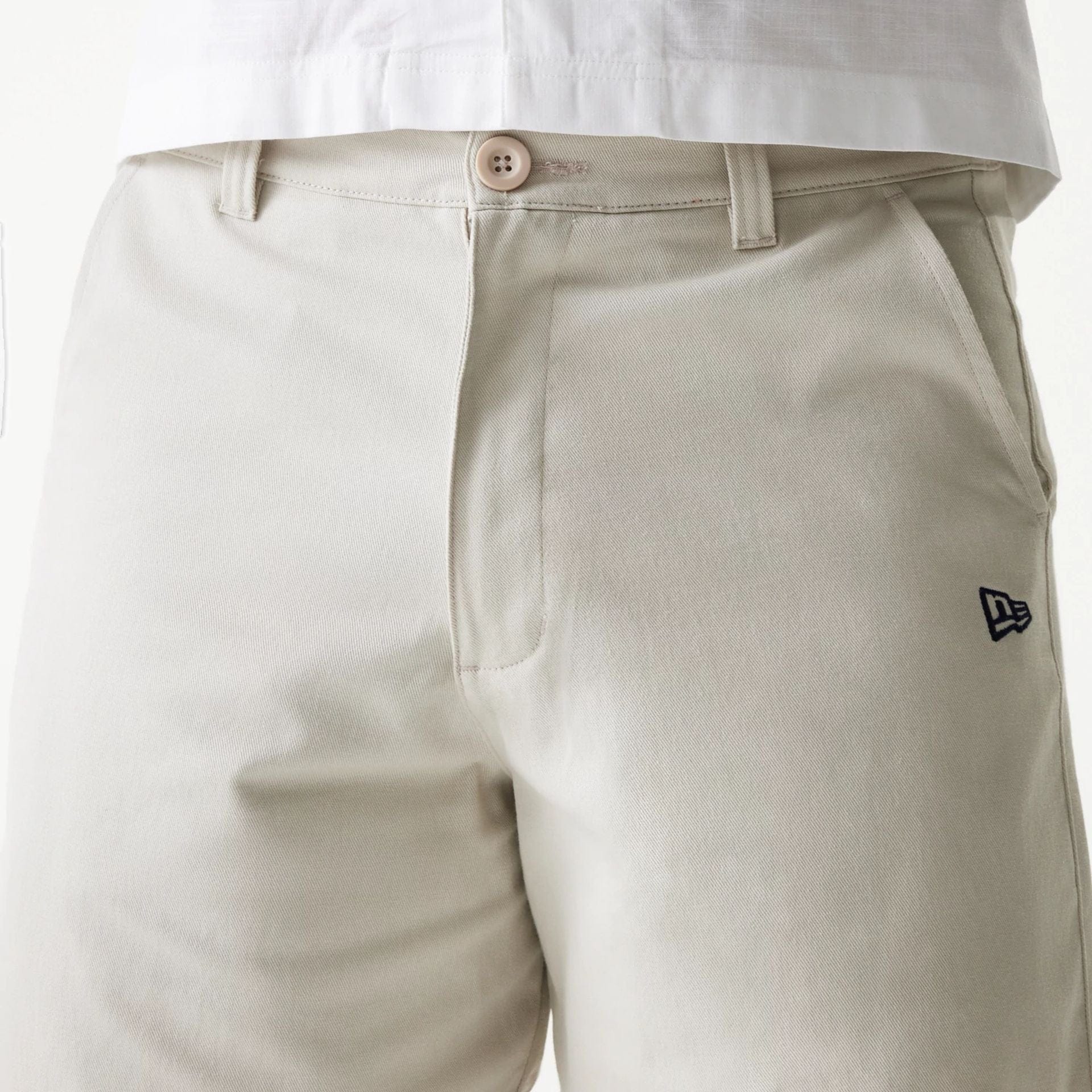 The Male model is wearing New Era Cream Chino Shorts 3