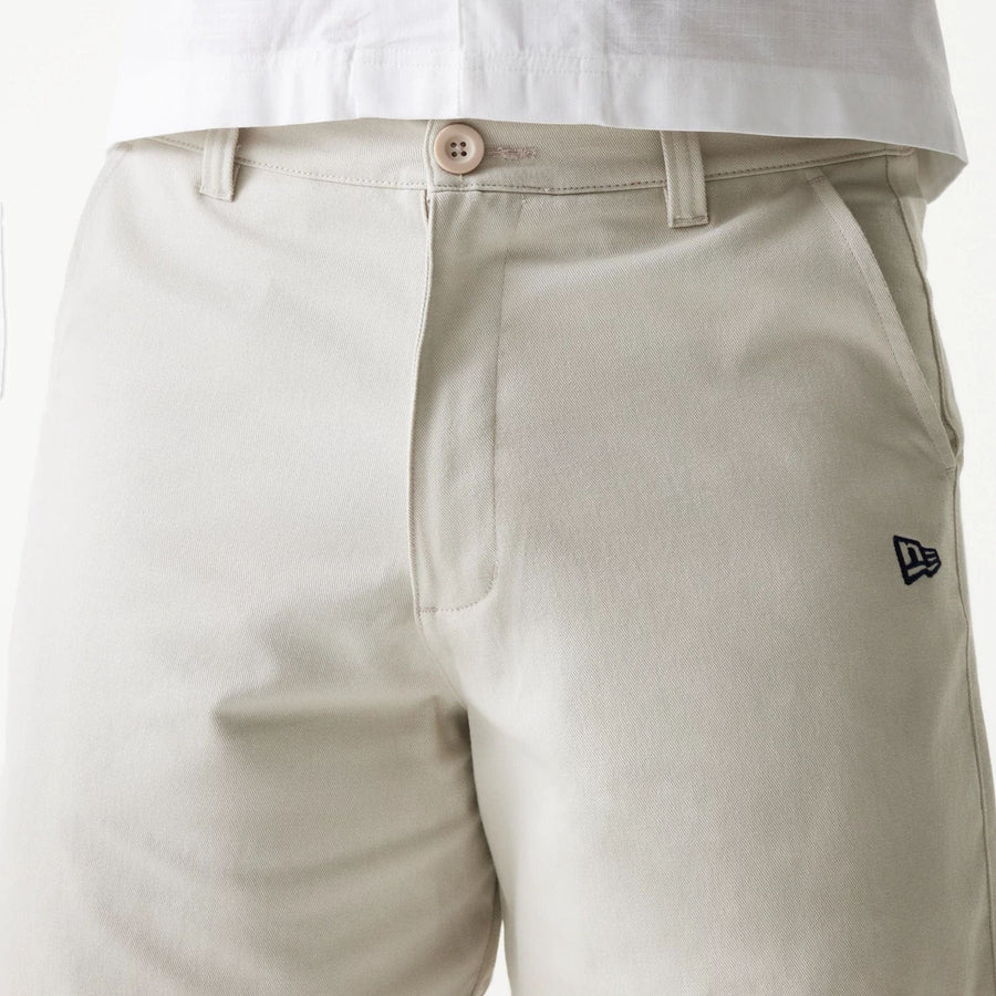 The Male model is wearing New Era Cream Chino Shorts 3