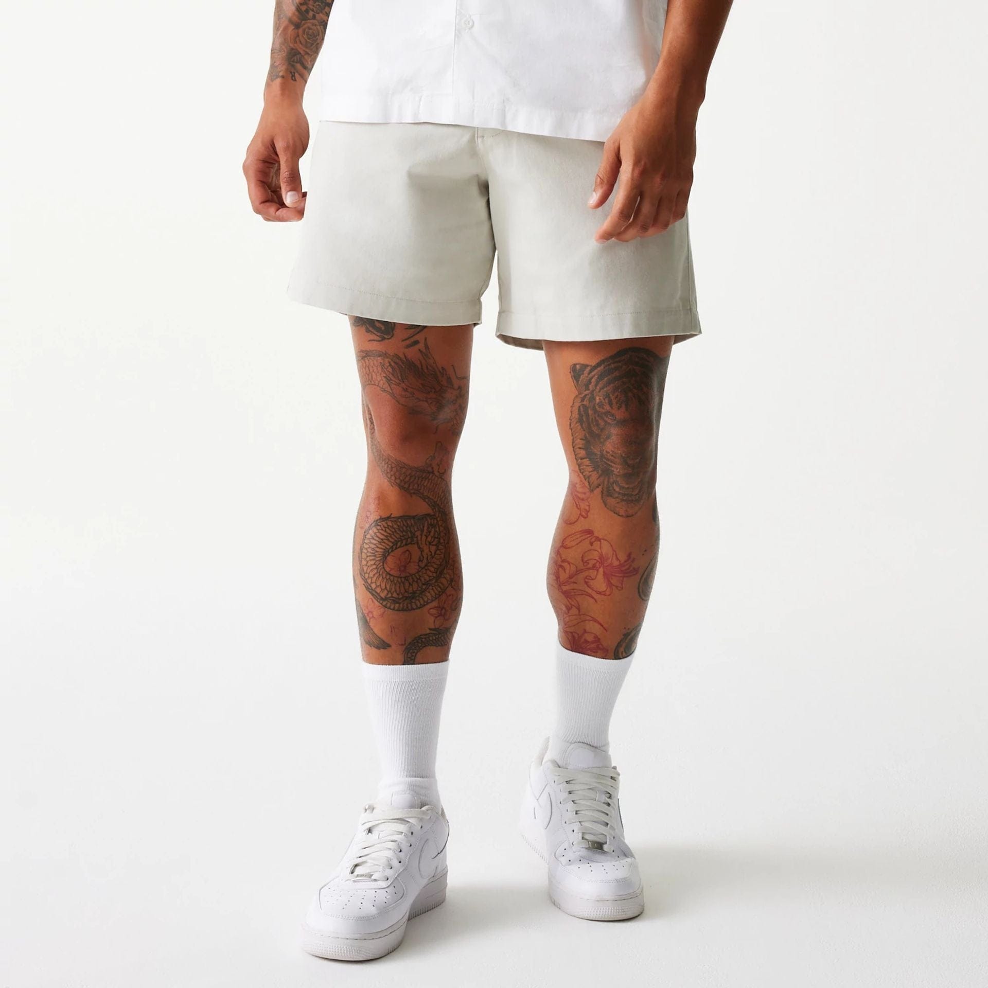 The Male model is wearing New Era Cream Chino Shorts 5