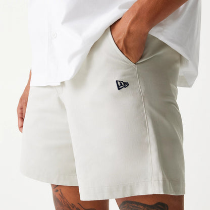 The Male model is wearing New Era Cream Chino Shorts 3