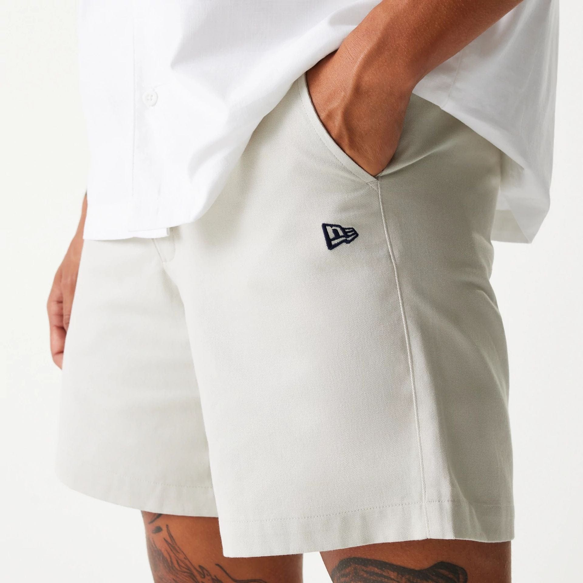 The Male model is wearing New Era Cream Chino Shorts 1