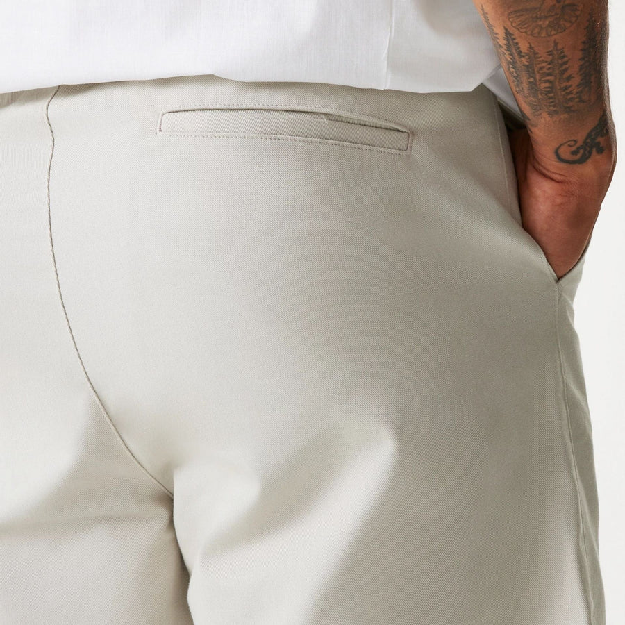 The Male model is wearing New Era Cream Chino Shorts 7