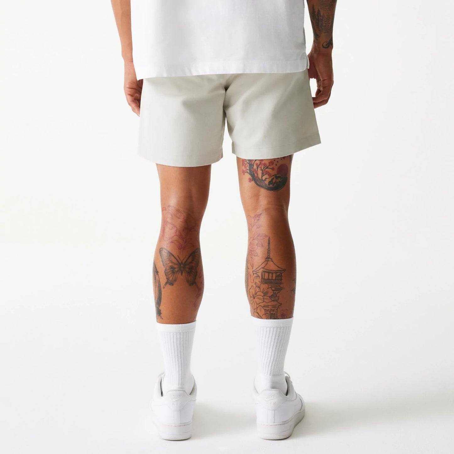 The Male model is wearing New Era Cream Chino Shorts 2
