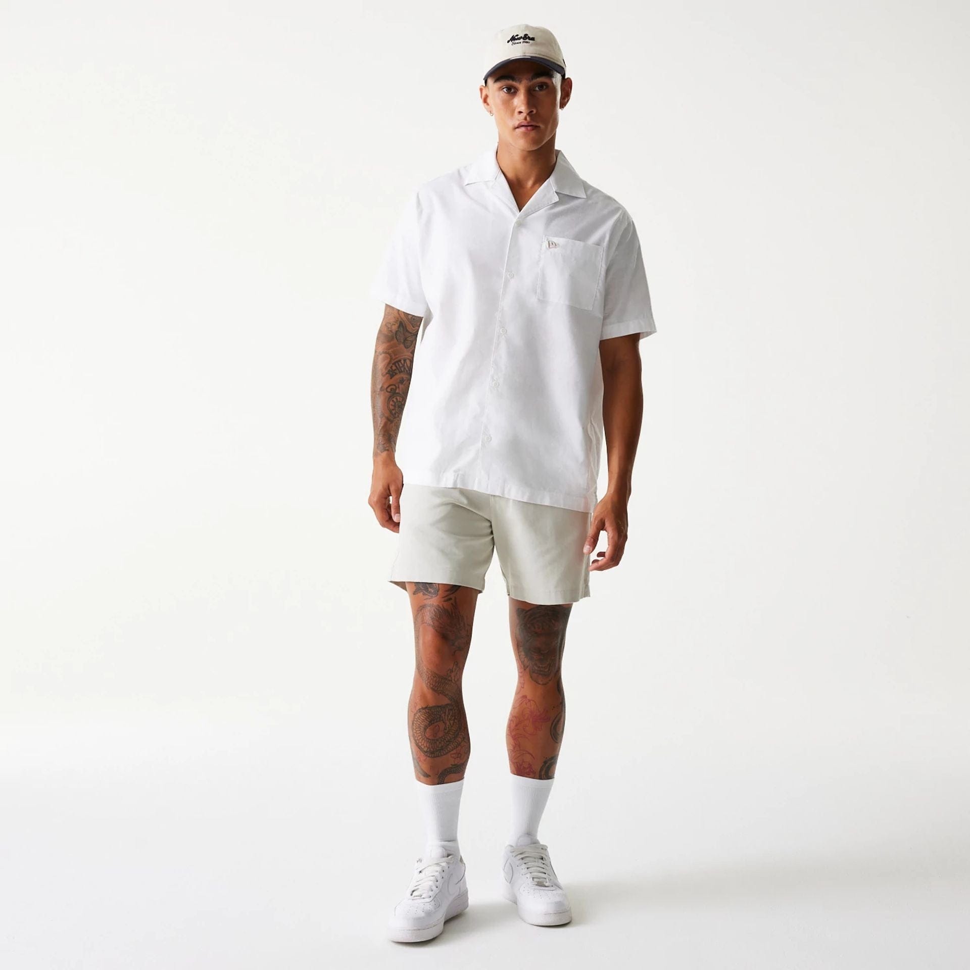 The Male model is wearing New Era Cream Chino Shorts 8