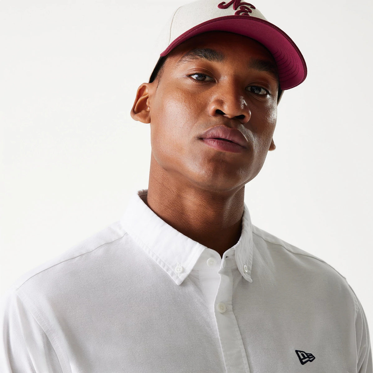 The Male model is wearing New Era White Long Sleeve Shirt 4