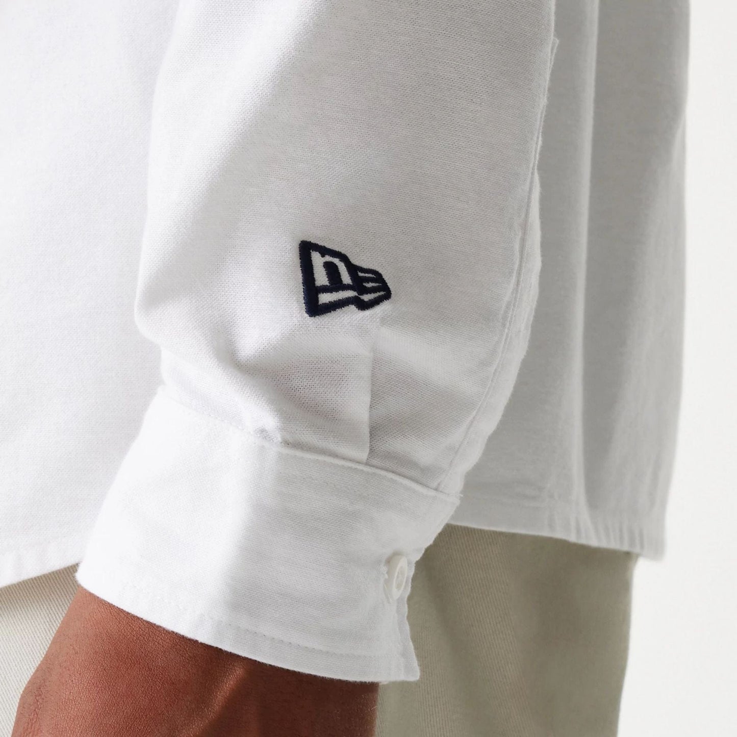 The Male model is wearing New Era White Long Sleeve Shirt 5