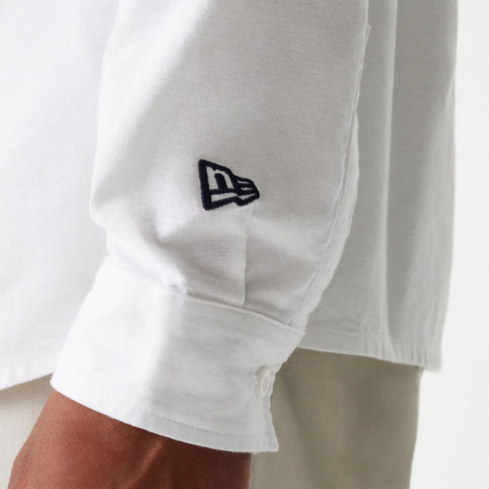 The Male model is wearing New Era White Long Sleeve Shirt 5