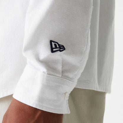 The Male model is wearing New Era White Long Sleeve Shirt 5