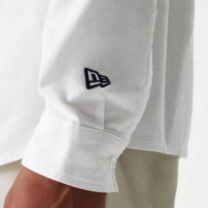 The Male model is wearing New Era White Long Sleeve Shirt 5