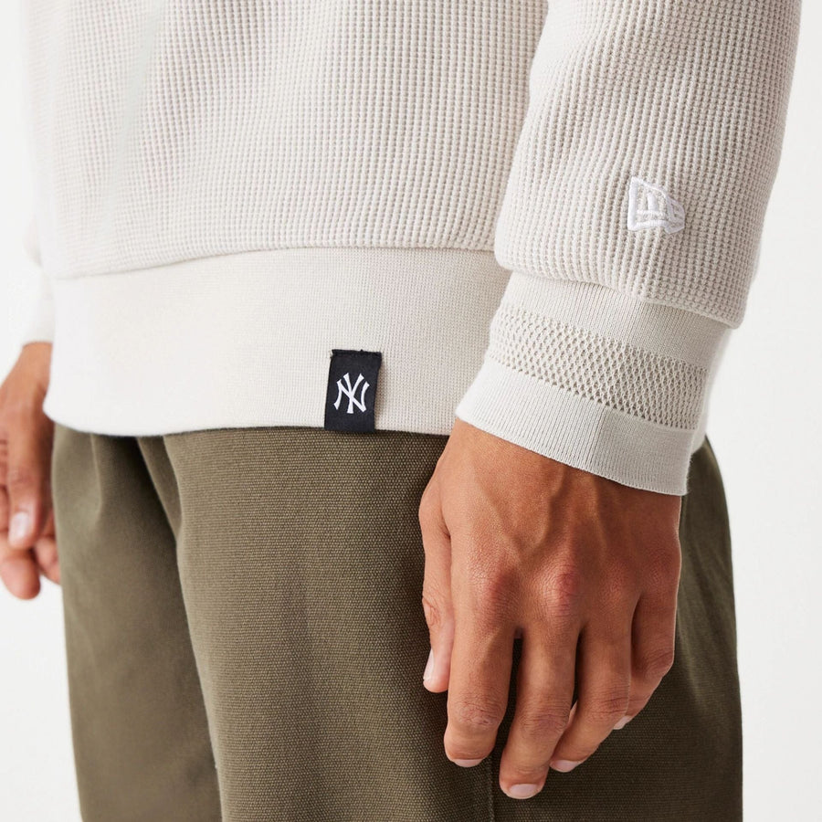 The Male model is wearing New York Yankees MLB Waffle Cream Oversized Crew Neck Sweater 6