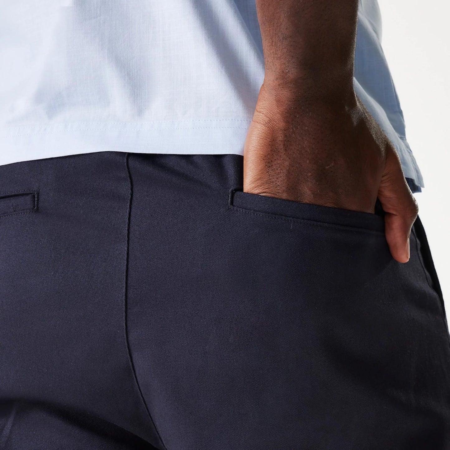 The Male model is wearing New Era Navy Chino Shorts 5