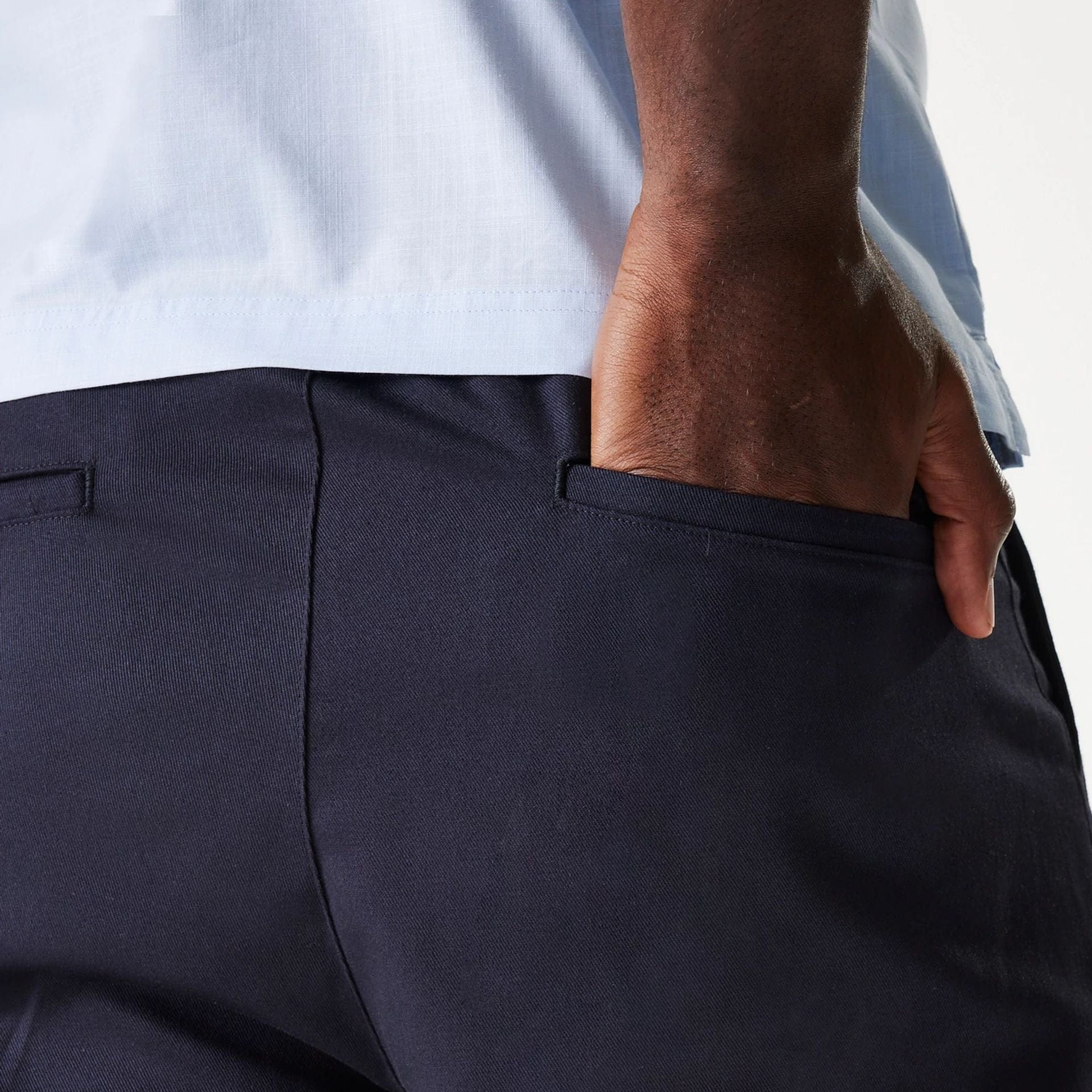 The Male model is wearing New Era Navy Chino Shorts 5