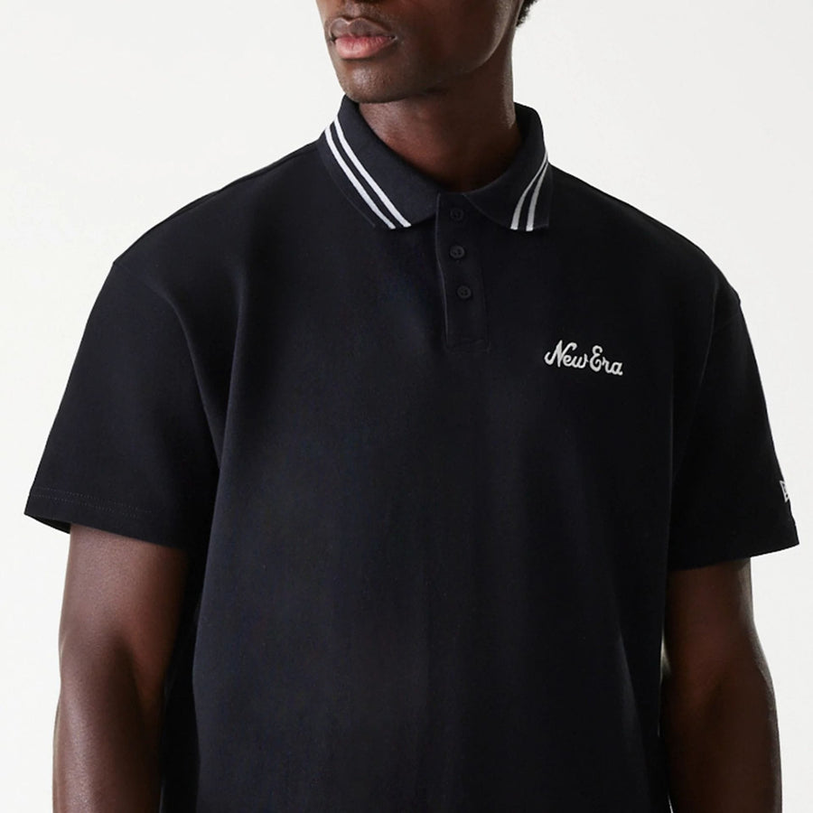 The Male model is wearing New Era Drop Shoulder Black Polo Shirt 4