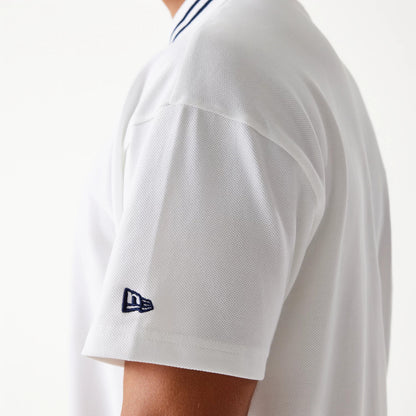The Male model is wearing New Era Drop Shoulder White Polo Shirt 5