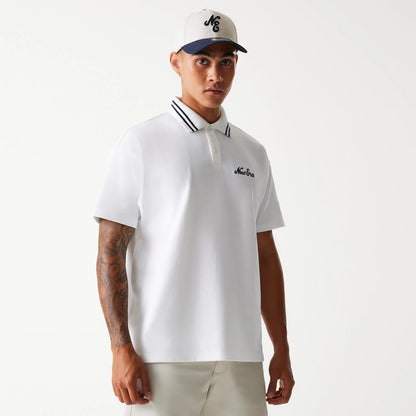 The Male model is wearing New Era Drop Shoulder White Polo Shirt 1
