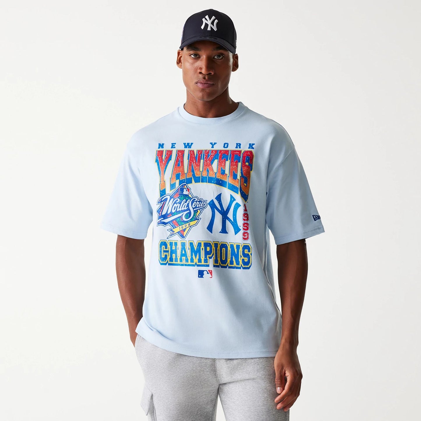 The Male model is wearing New York Yankees MLB World Series Pastel Blue Oversized T-Shirt 4
