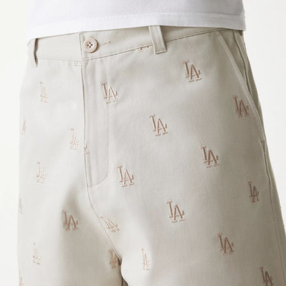The Male model is wearing LA Dodgers MLB Monogram Cream Shorts 6