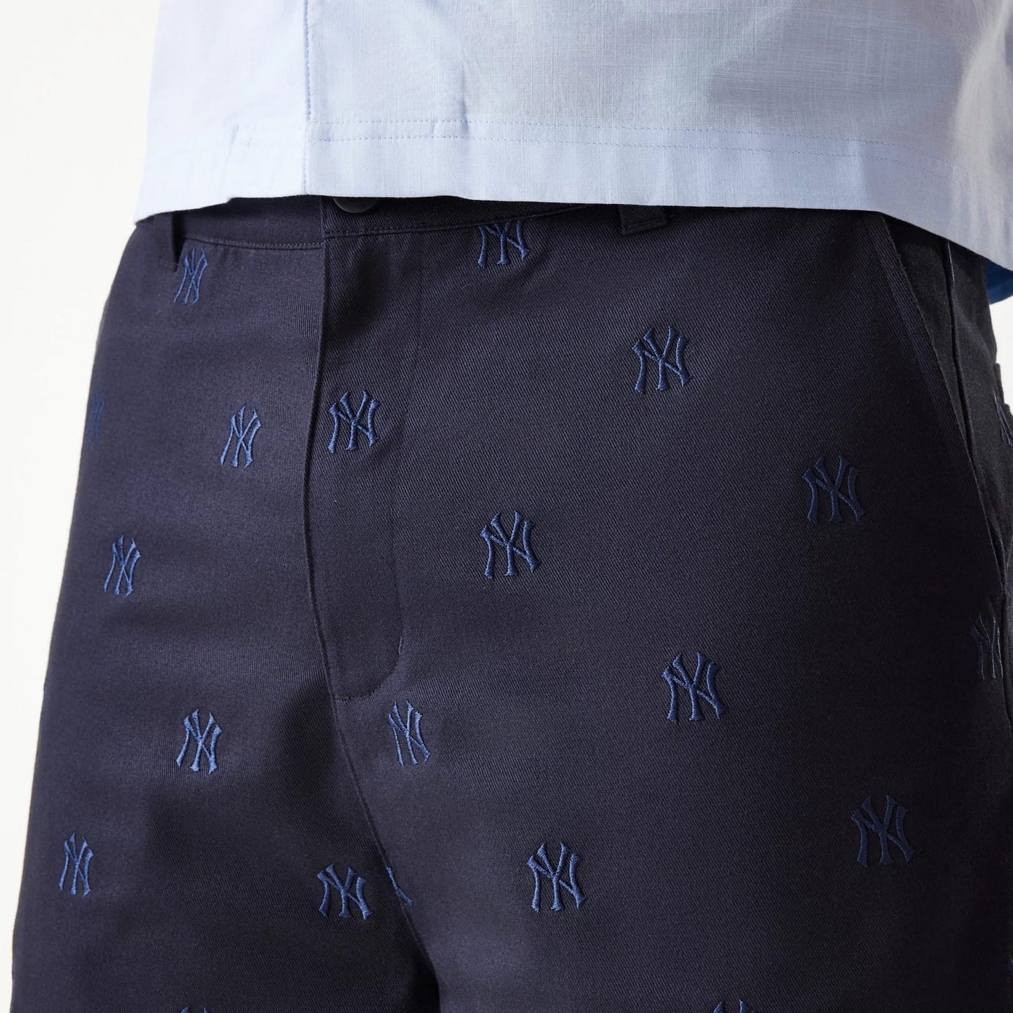 The Male model is wearing New York Yankees MLB Monogram Navy Shorts 5