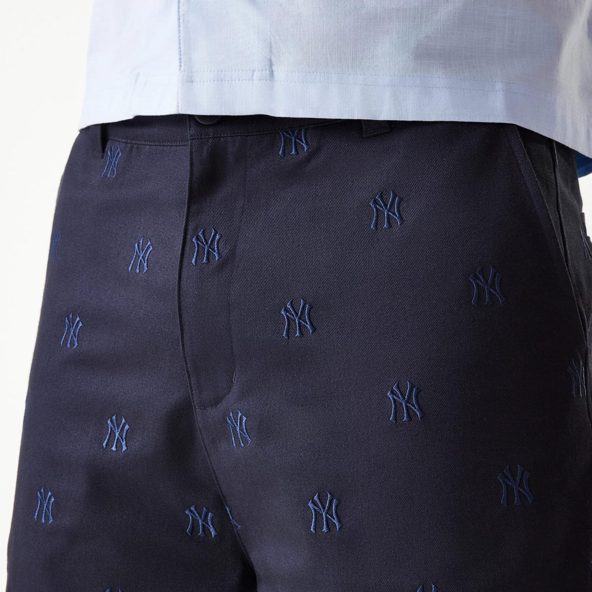 The Male model is wearing New York Yankees MLB Monogram Navy Shorts 5
