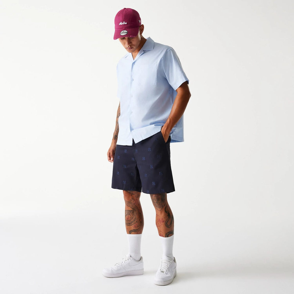 The Male model is wearing New York Yankees MLB Monogram Navy Shorts 8