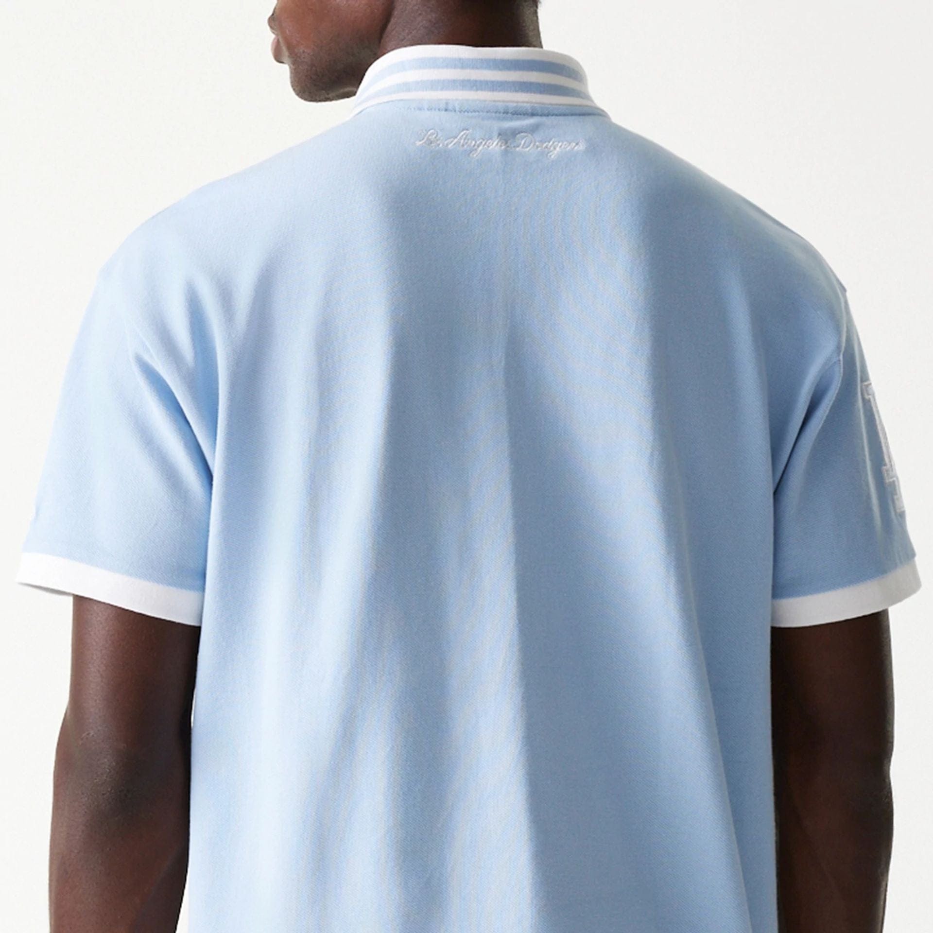 The Male model is wearing LA Dodgers MLB Graphic Pastel Blue Polo Shirt 7