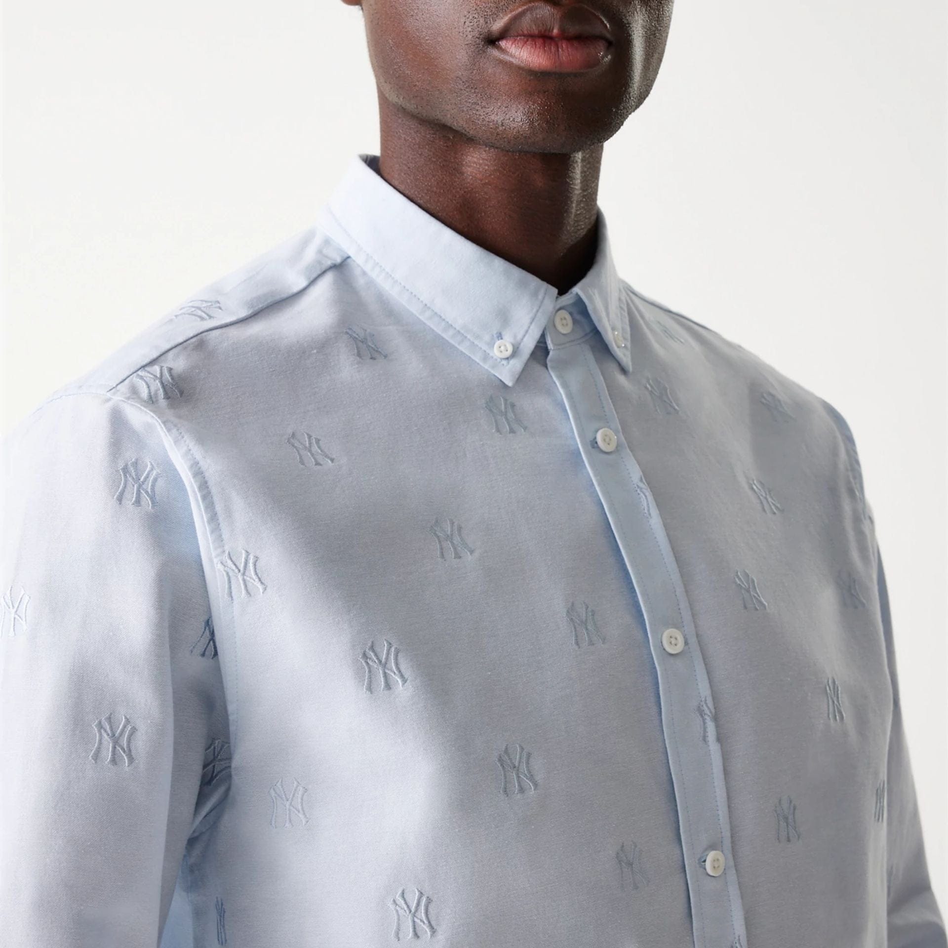 The Male model is wearing New York Yankees MLB Monogram Pastel Blue Long Sleeve Shirt 3